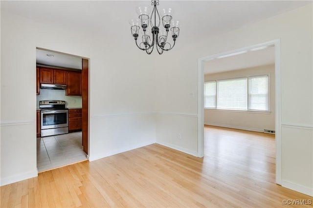 2206 Milbank Rd, Glen Allen, VA 23229 - unfurnished dining area featuring a chandelier, light wood finished floors, and baseboards