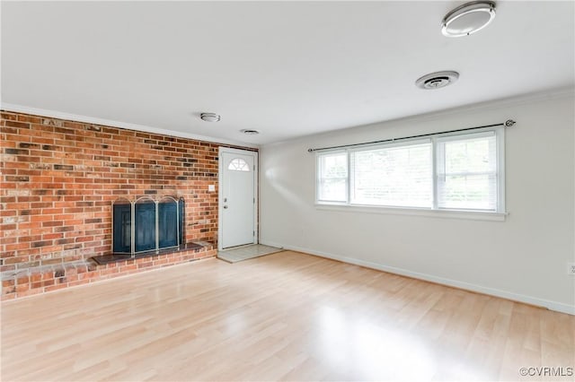 2206 Milbank Rd, Glen Allen, VA 23229 - unfurnished living room with wood finished floors, baseboards, a brick fireplace, and ornamental molding