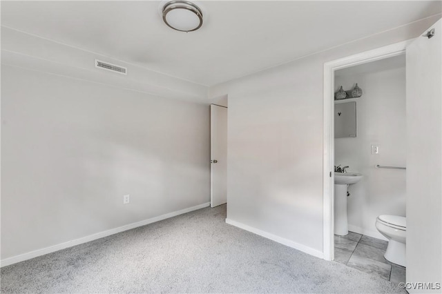 2206 Milbank Rd, Glen Allen, VA 23229 - unfurnished bedroom with baseboards, ensuite bathroom, and carpet