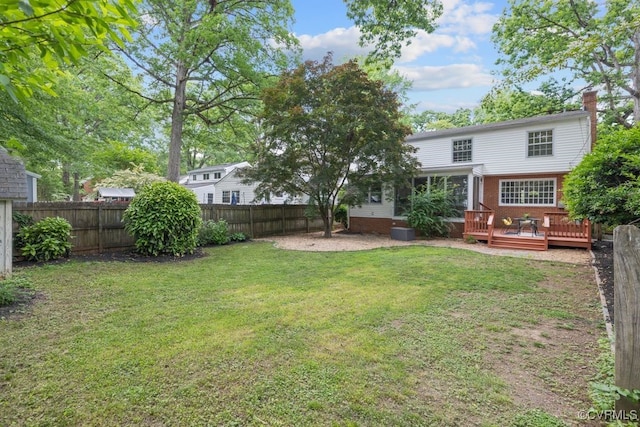 view of yard featuring a wooden deck