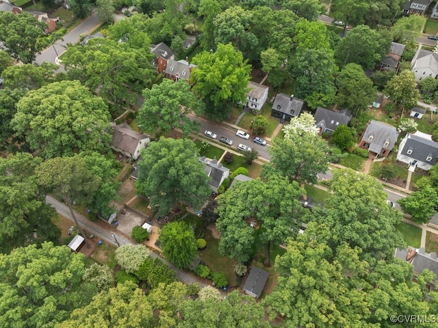 aerial view of property and surrounding area with nearby suburban area