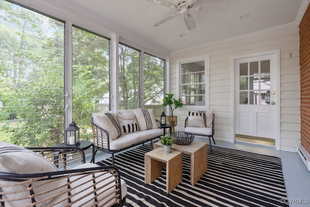 sunroom with a ceiling fan and outdoor lounge area
