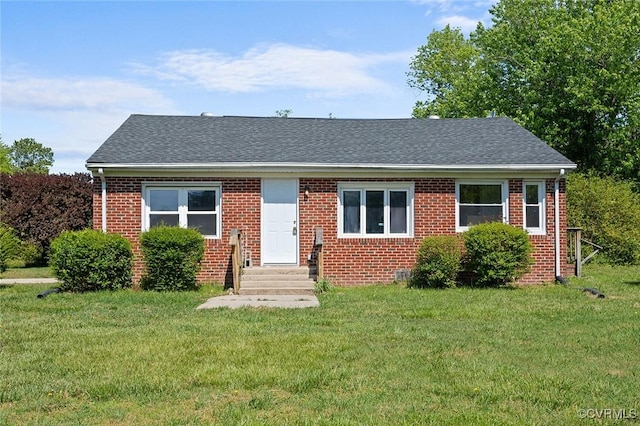 2943 Owens Mill Rd, King & Queen, VA 23148 - view of front facade with a front lawn, entry steps, brick siding, and roof with shingles