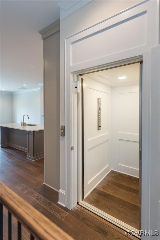 3325 Haydenpark Ln, Henrico, VA 23233 - elevator with wood finished floors and crown molding