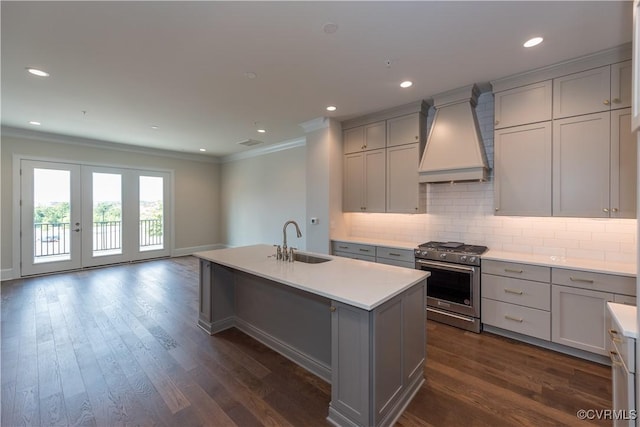 3325 Haydenpark Ln, Henrico, VA 23233 - kitchen with high end stove, gray cabinetry, custom range hood, crown molding, and light countertops