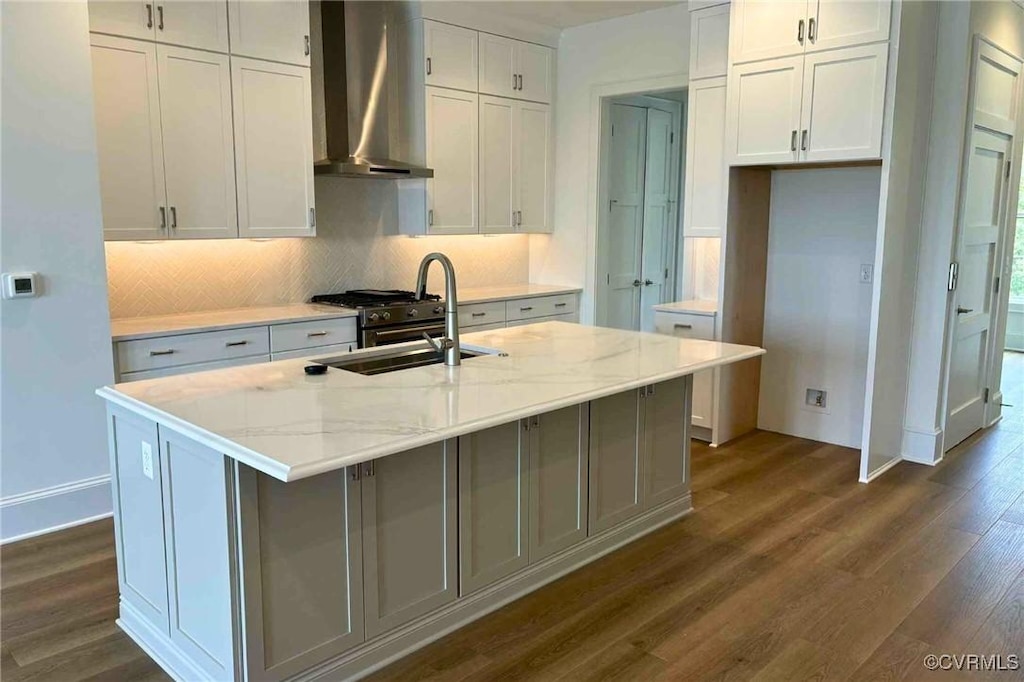 3327 Haydenpark Ln, Henrico, VA 23233 - kitchen with wall chimney range hood, a sink, dark wood-type flooring, backsplash, and white cabinets