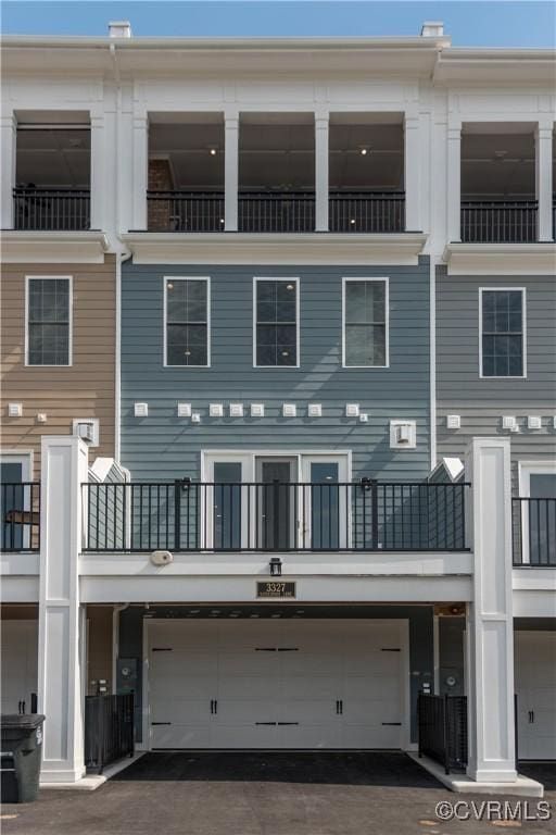 3327 Haydenpark Ln, Henrico, VA 23233 - back of house with a balcony and an attached garage