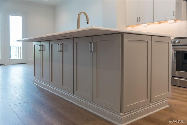 3327 Haydenpark Ln, Henrico, VA 23233 - kitchen featuring stainless steel range with electric cooktop, gray cabinetry, light wood-style floors, light countertops, and crown molding