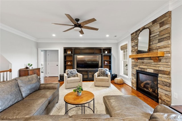 1662 Indys Run, Maidens, VA 23102 - living room with a ceiling fan, wood finished floors, a stone fireplace, ornamental molding, and recessed lighting