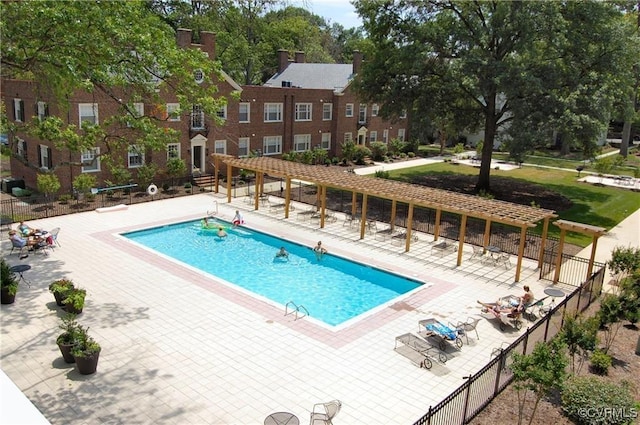 community pool with a pergola, fence, and a patio
