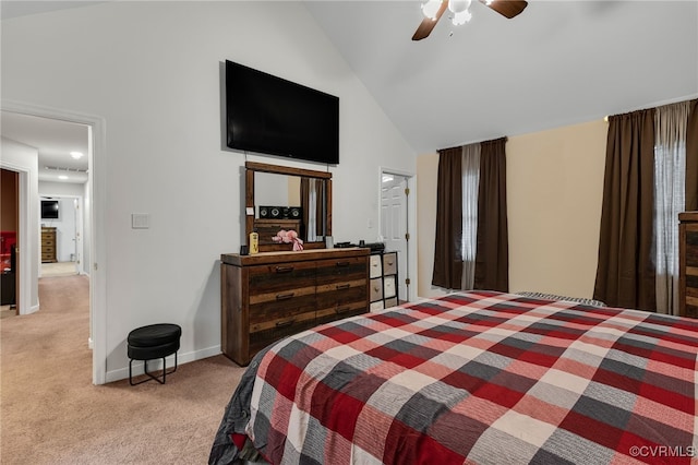 bedroom with light colored carpet, high vaulted ceiling, a ceiling fan, and baseboards