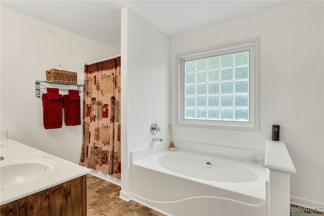 bathroom featuring a garden tub, baseboards, a shower with shower curtain, and double vanity