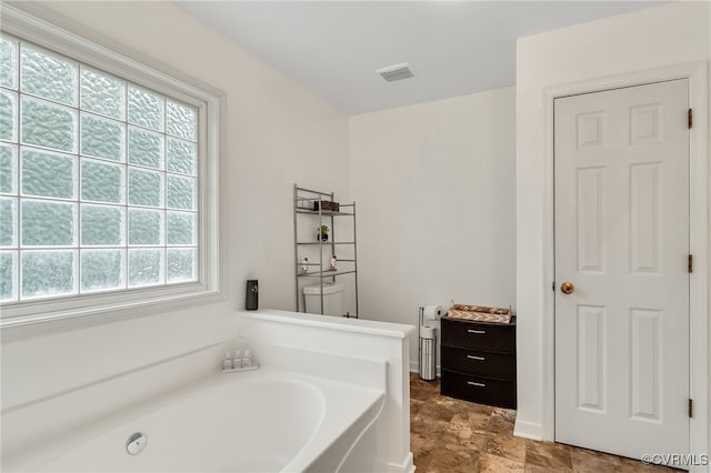bathroom featuring a garden tub