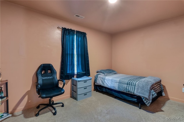 carpeted bedroom with baseboards
