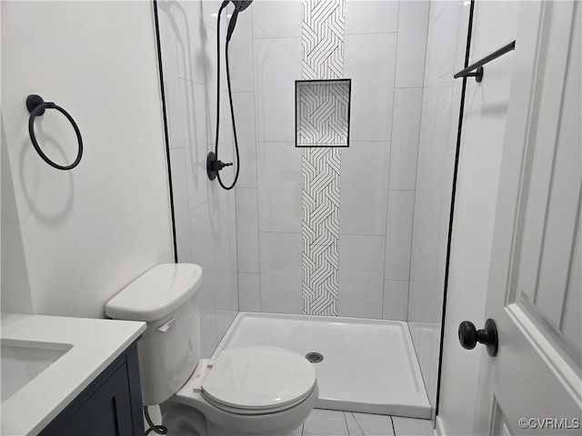 full bathroom featuring toilet, a shower stall, and vanity