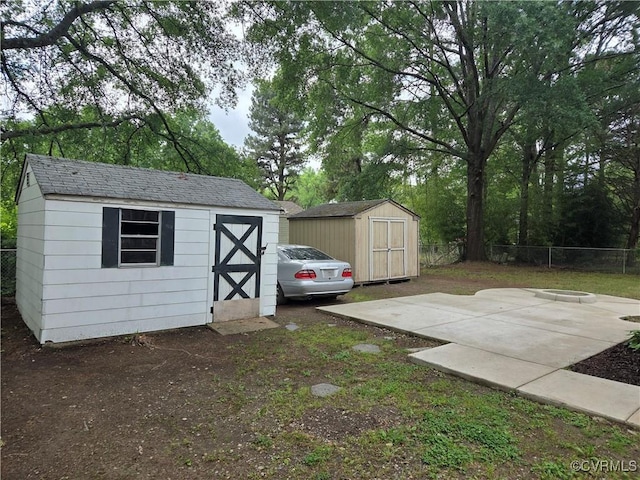 view of shed with fence