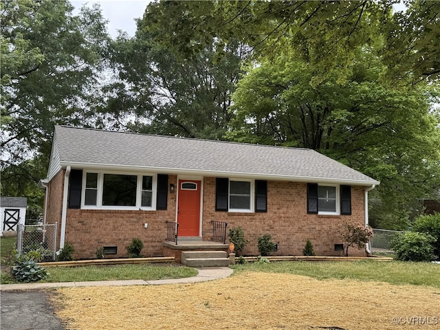 view of front of property featuring crawl space, brick siding, and a shingled roof