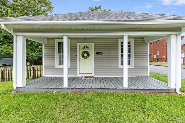 1201 W Broadway, Hopewell, VA 23860 - view of front of home with a porch, a front lawn, and roof with shingles