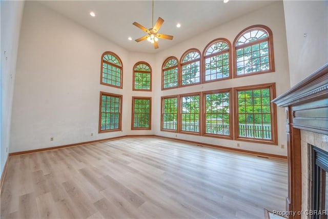 319 Parrotts Cove Rd, Water View, VA 23180 - unfurnished living room featuring a ceiling fan, a fireplace, wood finished floors, recessed lighting, and baseboards