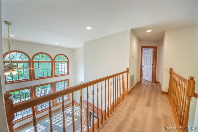 319 Parrotts Cove Rd, Water View, VA 23180 - corridor with an upstairs landing, light wood finished floors, recessed lighting, and baseboards