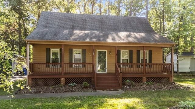 view of front facade featuring a porch and a shingled roof