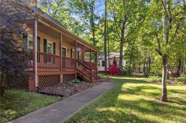 view of home's exterior with covered porch and a yard