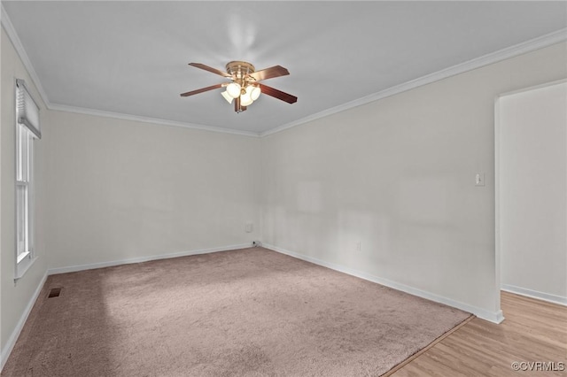 unfurnished room featuring ceiling fan, baseboards, crown molding, and light wood-type flooring