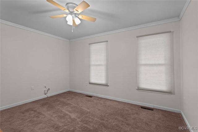 unfurnished room with carpet floors, crown molding, baseboards, and ceiling fan