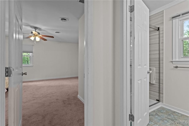 bathroom featuring a ceiling fan and baseboards