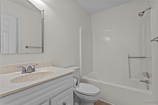 bathroom with vanity, toilet, and shower / bathtub combination