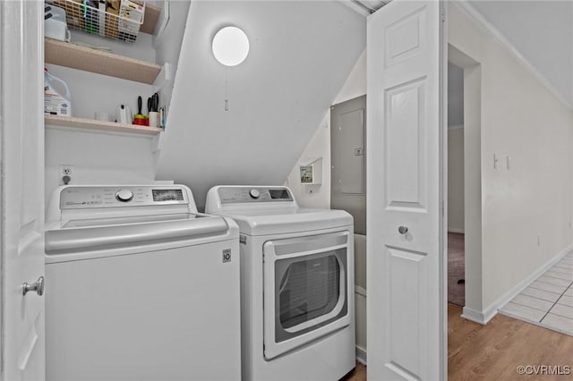 washroom featuring washer and dryer and wood finished floors