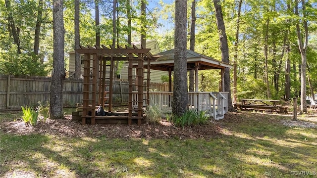 view of outdoor structure with fence and a gazebo
