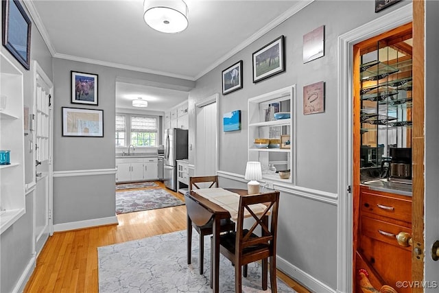 204 College Ave, Ashland, VA 23005 - dining room featuring light wood-type flooring and crown molding