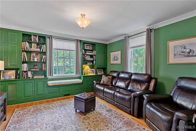 204 College Ave, Ashland, VA 23005 - living room featuring crown molding and light wood-style floors