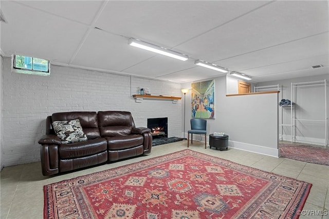 204 College Ave, Ashland, VA 23005 - tiled living room with a brick fireplace and brick wall