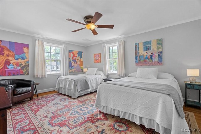 204 College Ave, Ashland, VA 23005 - bedroom with multiple windows, crown molding, wood finished floors, and a ceiling fan