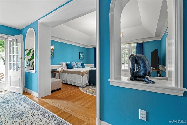 204 College Ave, Ashland, VA 23005 - bedroom featuring wood finished floors, access to exterior, and arched walkways