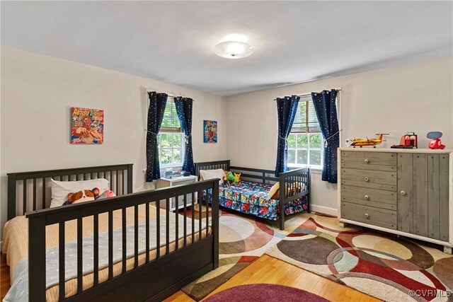 204 College Ave, Ashland, VA 23005 - bedroom featuring multiple windows and wood finished floors