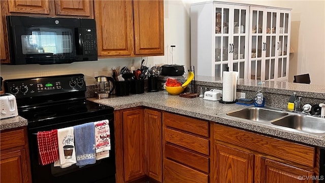 7211 Norwood Pond Ct, Midlothian, VA 23112 - kitchen with black appliances, a sink, and brown cabinets