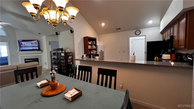 7211 Norwood Pond Ct, Midlothian, VA 23112 - dining space with a chandelier, a tiled fireplace, and high vaulted ceiling
