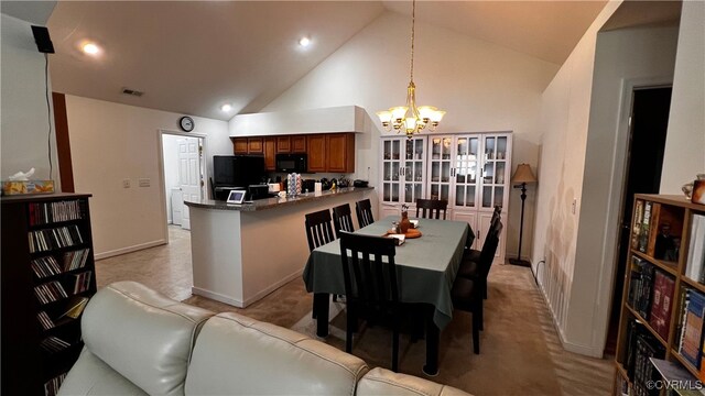 7211 Norwood Pond Ct, Midlothian, VA 23112 - dining space featuring a chandelier, high vaulted ceiling, light colored carpet, and baseboards