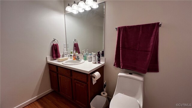 7211 Norwood Pond Ct, Midlothian, VA 23112 - half bath with toilet, vanity, and wood finished floors