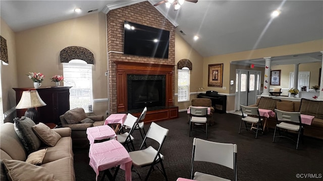 7211 Norwood Pond Ct, Midlothian, VA 23112 - living room with ornate columns, ceiling fan, dark colored carpet, a brick fireplace, and high vaulted ceiling