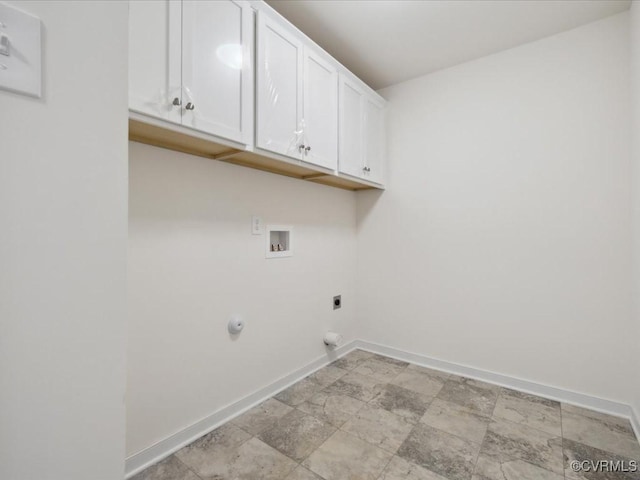 laundry room featuring cabinet space, baseboards, washer hookup, hookup for an electric dryer, and light stone finish flooring