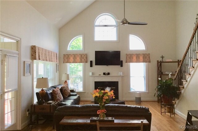 16748 Kipper Turn, Chesterfield, VA 23120 - living area with high vaulted ceiling, healthy amount of natural light, wood finished floors, and stairway