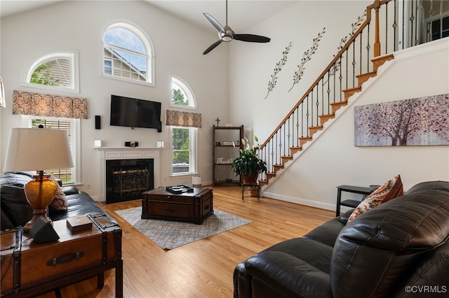 16748 Kipper Turn, Chesterfield, VA 23120 - living room with high vaulted ceiling, ceiling fan, wood finished floors, stairway, and a fireplace