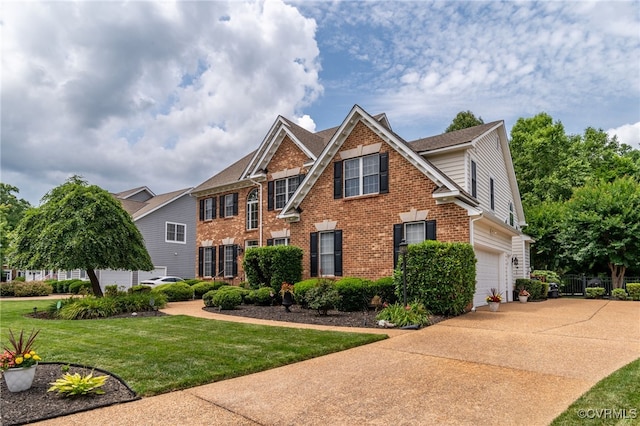 16748 Kipper Turn, Chesterfield, VA 23120 - view of front of home with brick siding, a garage, a front lawn, and driveway