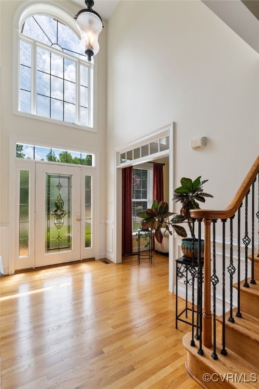 16748 Kipper Turn, Chesterfield, VA 23120 - foyer entrance featuring a towering ceiling, light wood-style floors, and stairs