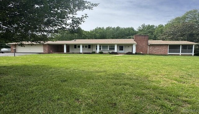 1863 Mill Quarter Rd, Powhatan, VA 23139 - single story home with an attached garage, a chimney, a front lawn, and concrete driveway