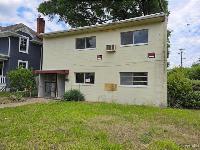 back of property with a yard
